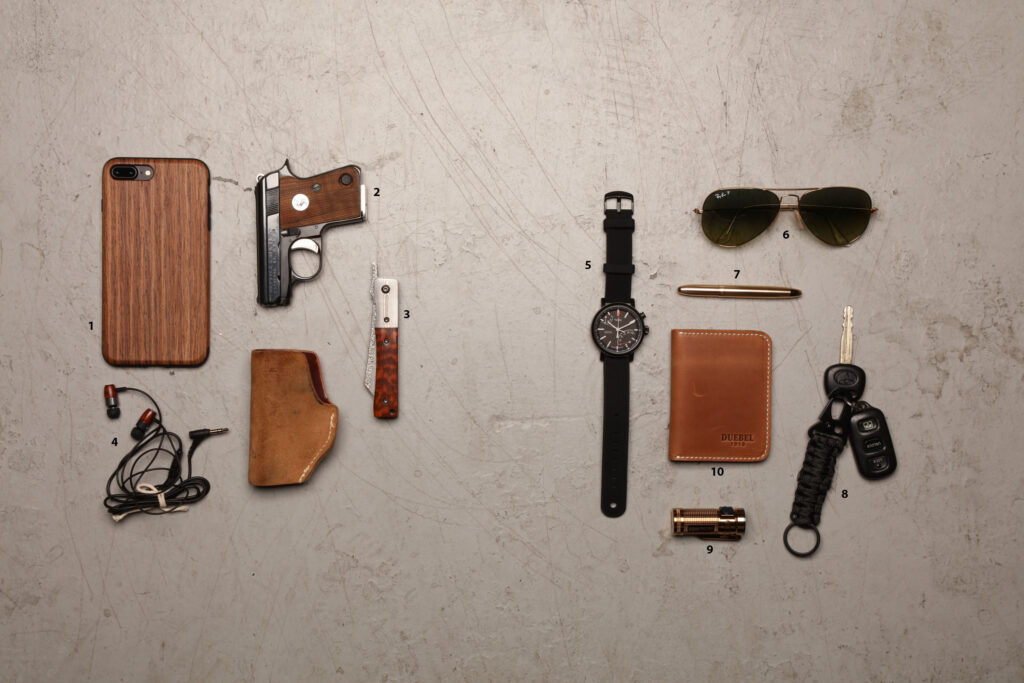 UN12 Magazine Everyday Carry Sling Shot Knife Comb Watch Multitool Ray Bans Colt Mini
